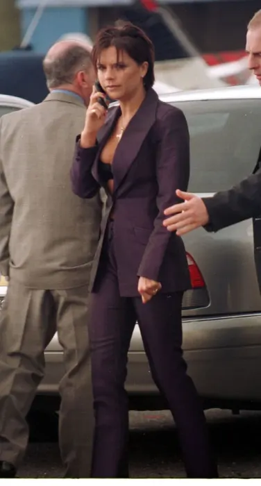 Framed Print : Victoria Adams Posh Spice talks on her mobile telephone as she prepares to leave with Framed Print : Victoria Adams Posh Spice talks on her mobile telephone as she prepares to leave with