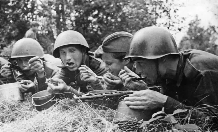 Framed Print : Victories make good appetites. Front line meal in USSR. Mealtime on the advancing Soviet