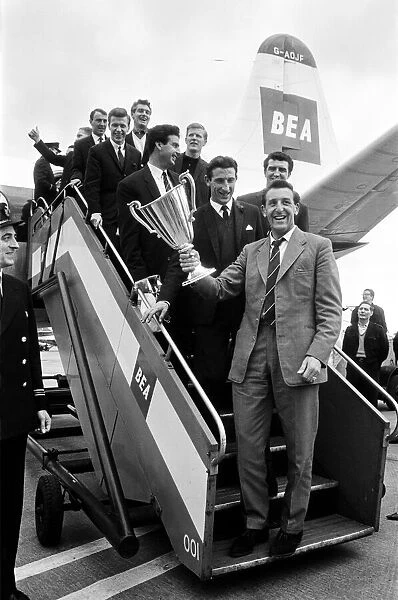 The victorious Tottenham Hotspur team holding European Cup Winners Cup Winners trophy as