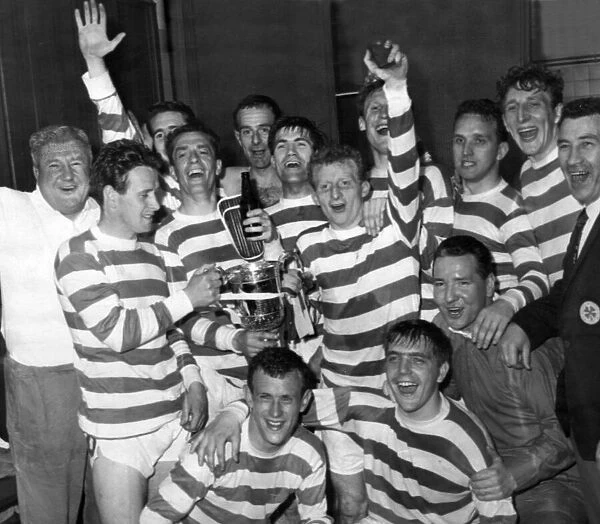 Victory celebrations for Celtic as they display the Scottish Cup they have just won by