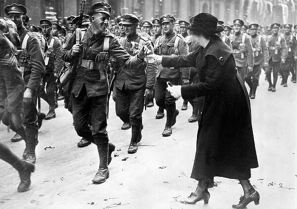 Victory Parade Colonial March May 1919. A spectator rushing to give a Canadian soldier a
