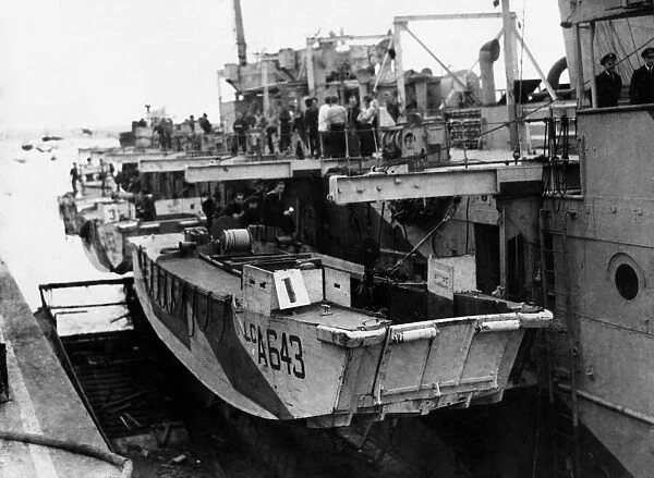 A view alongside an L. S. I showing landing craft swung on, davits