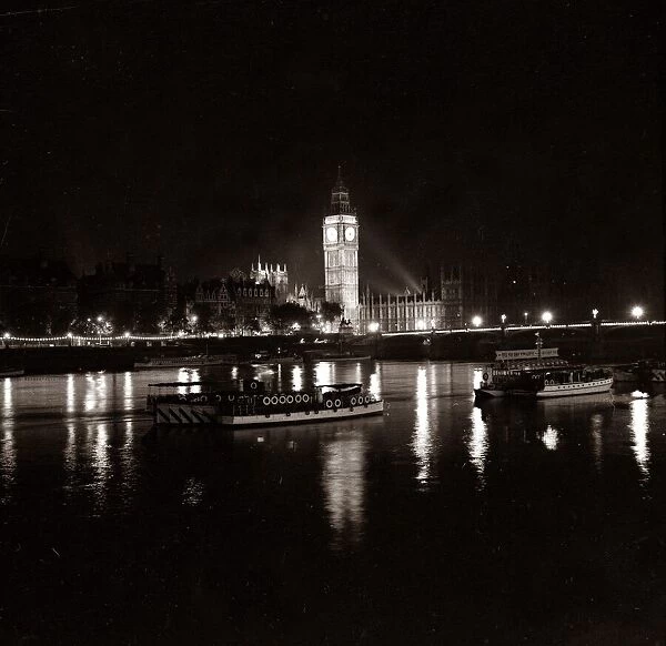 View of Big ben and the Houses of Parliament and New Scotland Yard lit up at night