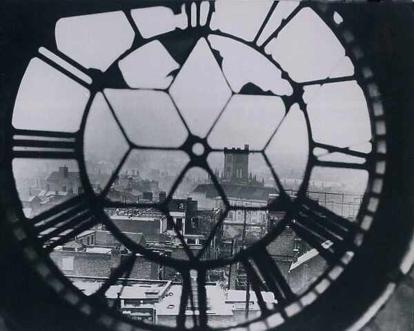 View through the bomb damaged clock on the market tower after the blitz in Coventry