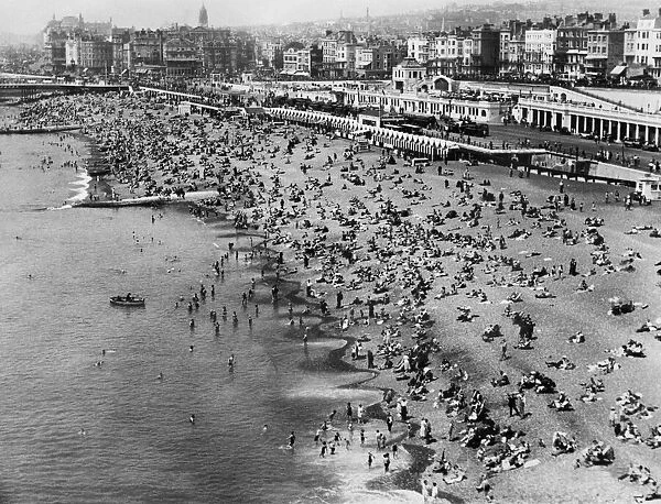 View of Brighton beach with holidaymakers in June 1934