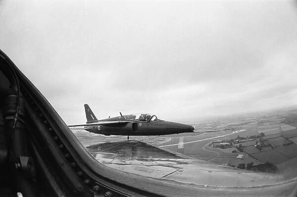 The view from the cockpit of a Red Arrow as they over fly RAF Little Rissington home of