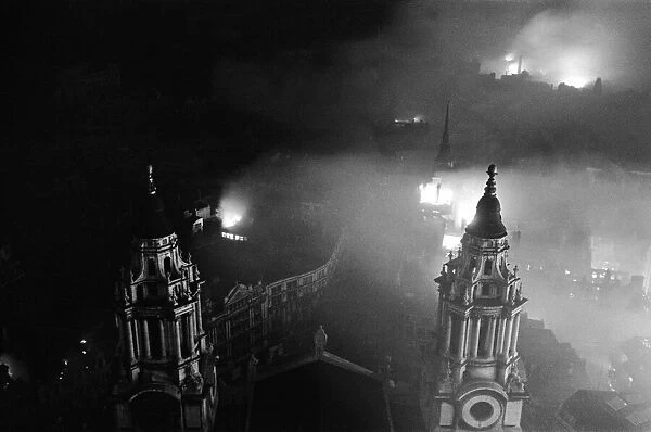 View from the dome of St Pauls Cathedral over Central London during a night of intense