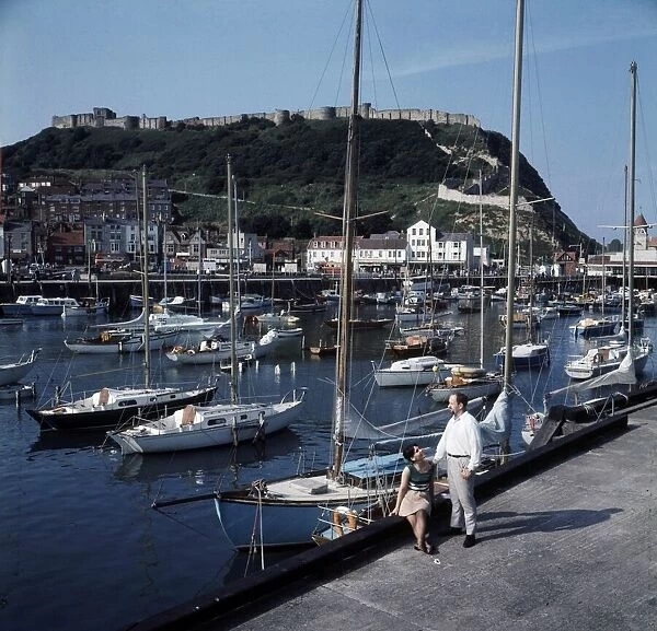 An view of the harbour in Scarborough, Yorkshire showing Castle Hill behind