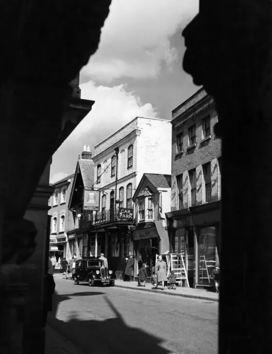 Framed Print : A view taken through an old archway off the main street in the old town of Hemel Framed Print : A view taken through an old archway off the main street in the old town of Hemel