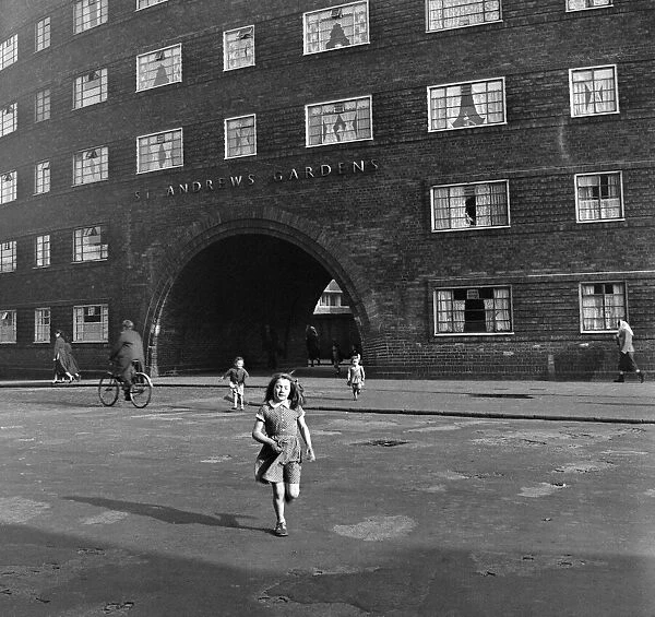 Views of Liverpool, 13th May 1954. Young girl outside St Andrews Gardens housing
