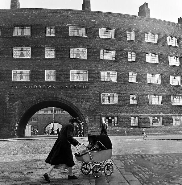 Views of Liverpool, 13th May 1954. Young mother pushing a pram outside St Andrews Gardens