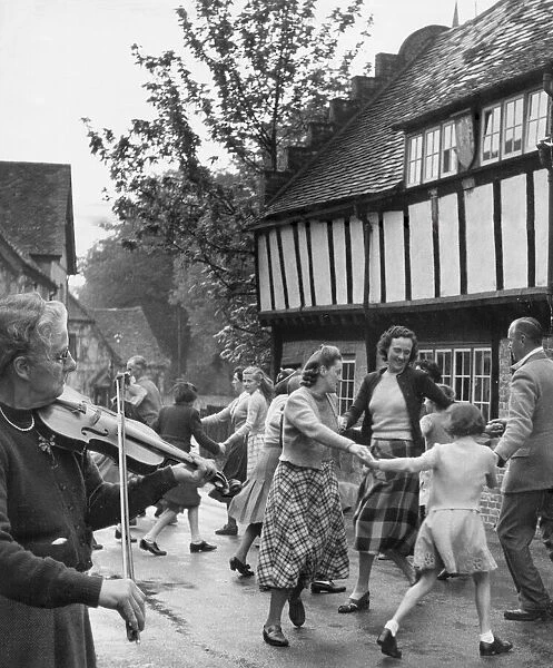 Village Fete. Miss Isabella Geddis plays her 200 year old fiddle for the residents of