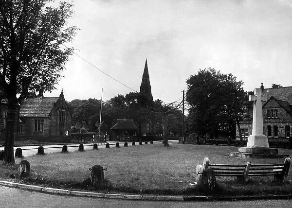The village green at Knowsley, with the church in the background. October 1964