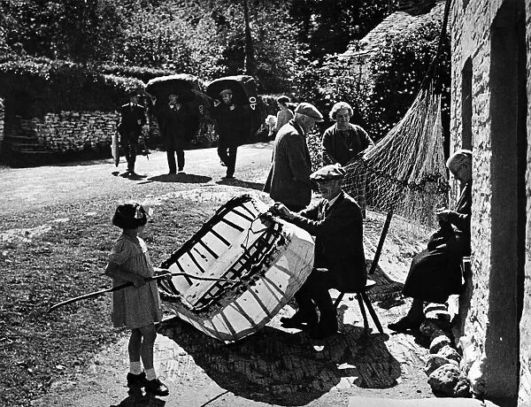 A Village street scene. Fishermen, Net menders, knitters
