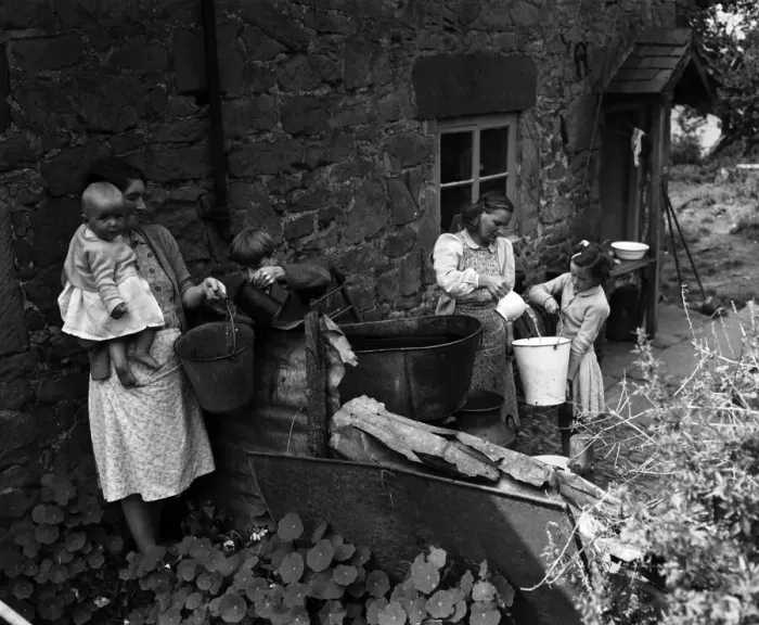 Framed Print : A village without water at Ruyton-XI-Towns, Shropshire. Churns are placed outside each Framed Print : A village without water at Ruyton-XI-Towns, Shropshire. Churns are placed outside each