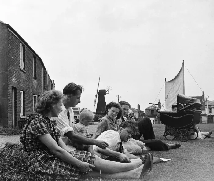 Framed Print : Villagers gather beside the village green at Meopham, Kent to watch their local cricket