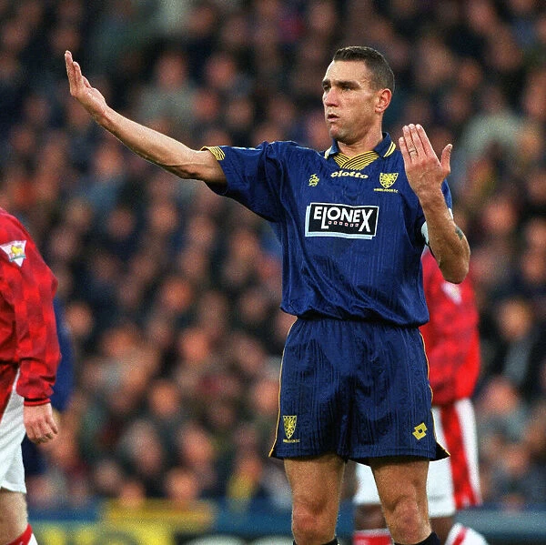 Vinnie Jones of Wimbledon signals to his teamates during the Premier League match between