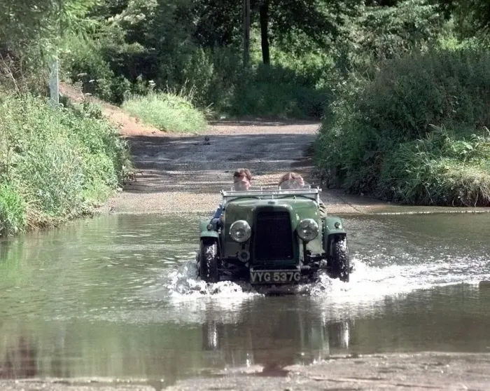 Framed Print : A vintage car passes through the ford at Coughton near Alcester Framed Print : A vintage car passes through the ford at Coughton near Alcester