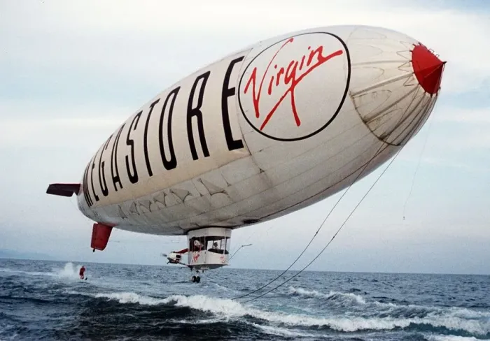 Framed Print : Virgin Airship - A man water skis behind an airship flying low over the sea Framed Print : Virgin Airship - A man water skis behind an airship flying low over the sea