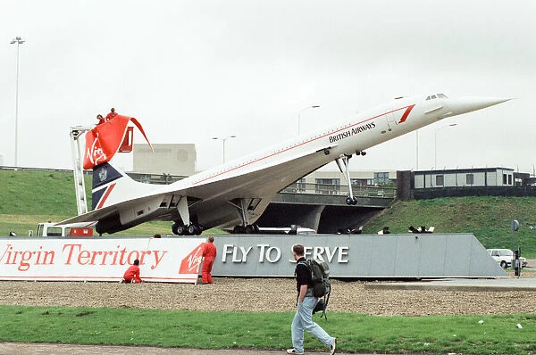 Virgin Group staff hijacking the British Airways Concorde model that stands at