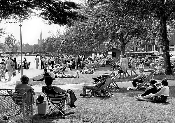 Visitors relaxing by the river Avon at Stratford-upon-Avon. 31st May 1978