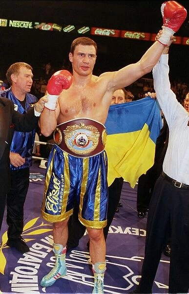 Vitali klitschko with arm in the air after knocking out britians Herbie Hide in two