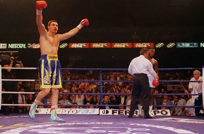 Framed Print : Vitali klitschko with arms in the air after knocking out britians Herbie Hide in two