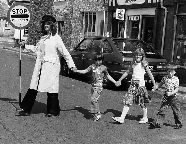 Viva Hamnel with children crossing the road 1978 in Callington Cornwall also sings