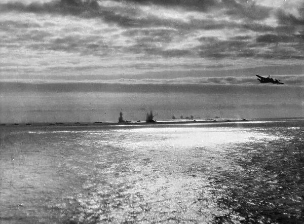Vivid action photograph recording a phase in a successful torpedo attack by Beaufighters