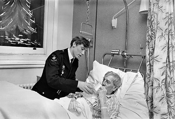 Volunteer Labour in Hospitals. 15 year old Robert Newport helping the Nurse in charge of