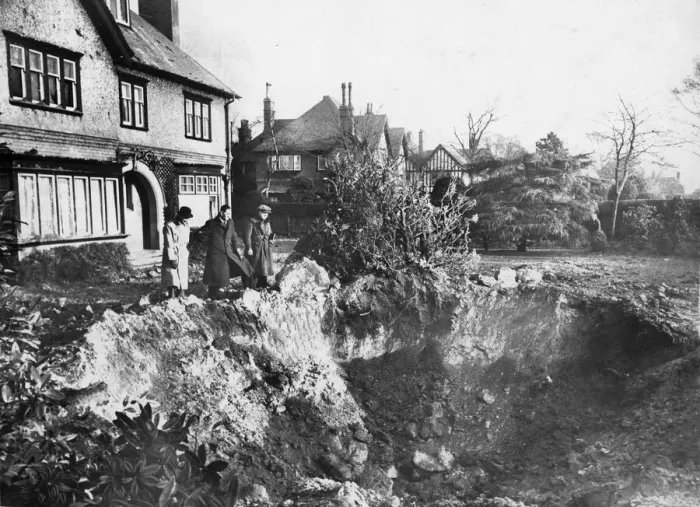 Framed Print : Vyner Road South, Birkenhead, Merseyside. A huge crater in the garden after an air