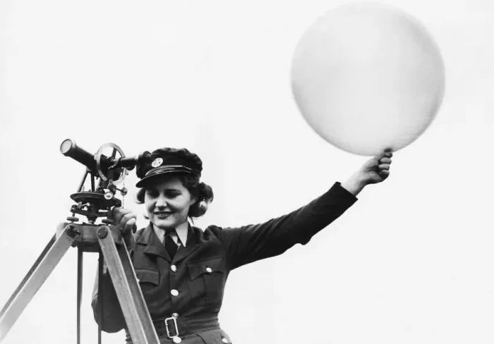 Framed Print : A W. A. A. F. meteorologist releasing a met balloon. 9th October 1941 Framed Print : A W. A. A. F. meteorologist releasing a met balloon. 9th October 1941