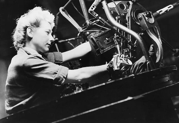 W. A. A. F. technicians adapt Mosquitos for far east war. Leading aircraft woman E. M