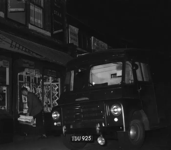 Framed Print : A W H Smith wholesale newsagents delivery driver seen here leaving the morning papers Framed Print : A W H Smith wholesale newsagents delivery driver seen here leaving the morning papers