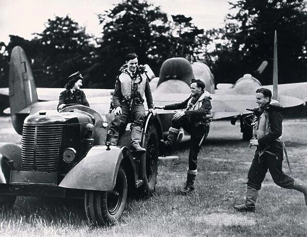 A Waaf driving a tractor tows a RAF Hudson bomber and its crew back to their dispersal