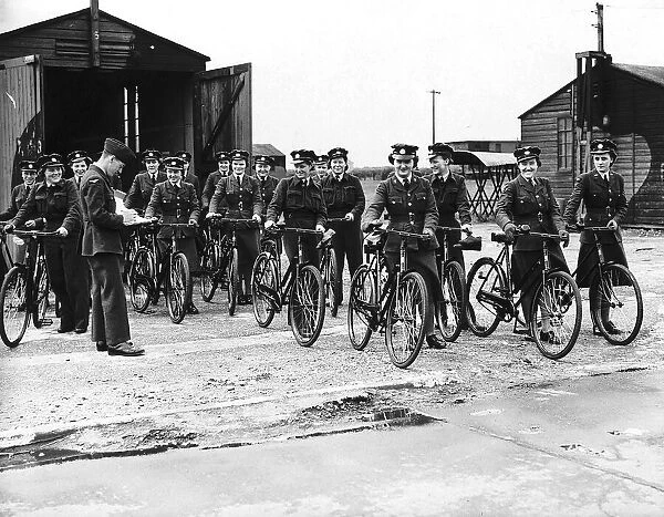 WaFs on an RAF base wheel out their bicycles at the end of their shifts