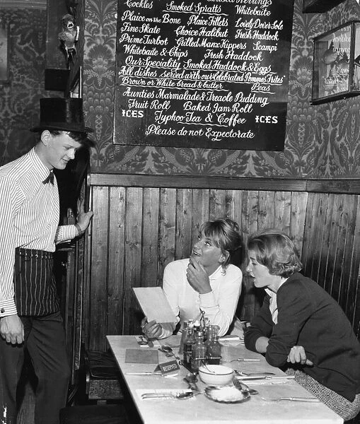 Waiter John Hughes serving customers at the Contented Sole