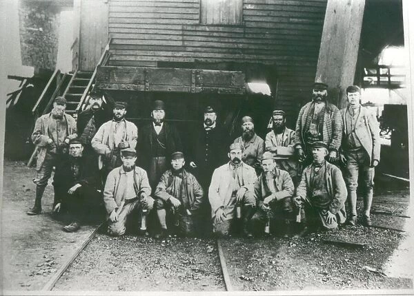 Waiting for the cage. Miners about to start their shift at Lambton Colliery. Circa 1920