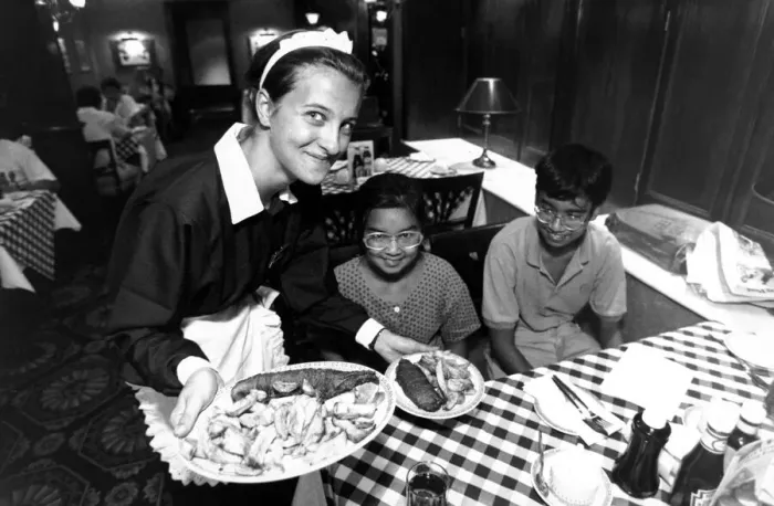 Framed Print : Waitress Georgina Bull serves Chinese kids chips at Ramsden Framed Print : Waitress Georgina Bull serves Chinese kids chips at Ramsden