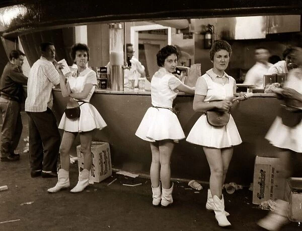 waitresses and waiters in a fast food restuarant mini skirts boots USA