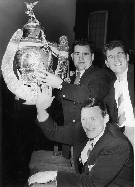 Wakefield Trinitys Captain D Turner, Albert Firth and Neil Fox hold the trophy aloft for