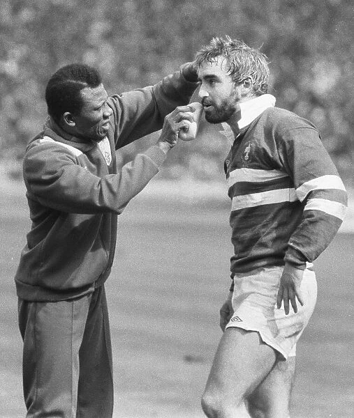 A Wakefield Trinty player receives treatment for a cut above the eye during the Rugby
