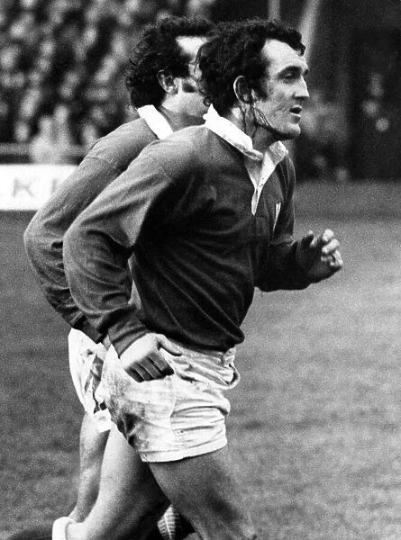 Wales v Ireland 1977. Welsh captain Phil Bennett runs up the pitch with blood streaming
