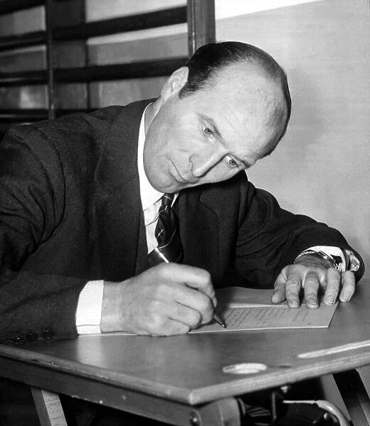 Wally Barnes Former Football Player of Arsenal - March 1961 taking an exam for