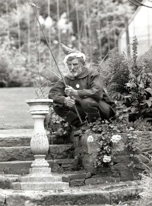 Framed Print : Walter Sherratt, aged 67, is posing as a garden gnome in his garden at Biddulph