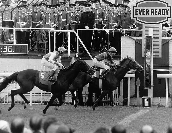 Walter Swinburn wins the Epsom Derby on Sharastani with Dancing Brave in cecond place