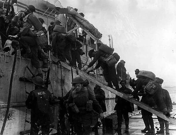 War: Invasion Of France June 1944 British Troops come ashore from aboard an