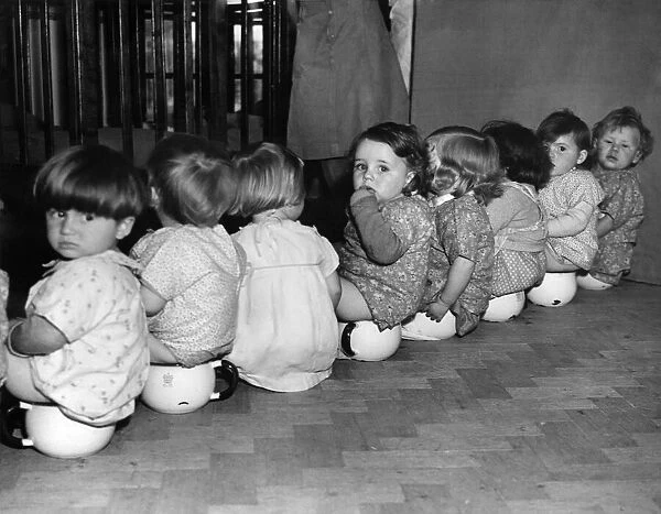 War-time Day Nursery at Watford: Potting time, or mind your own business