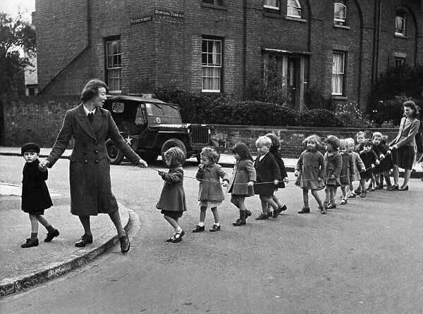 War workers children set out for a morning stroll in Cambridge