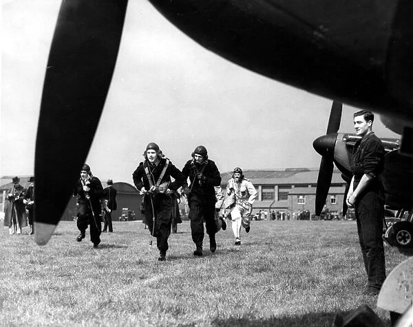 War - World War II - Battle of Britain - Picture shows Spitfire pilots rushing to their